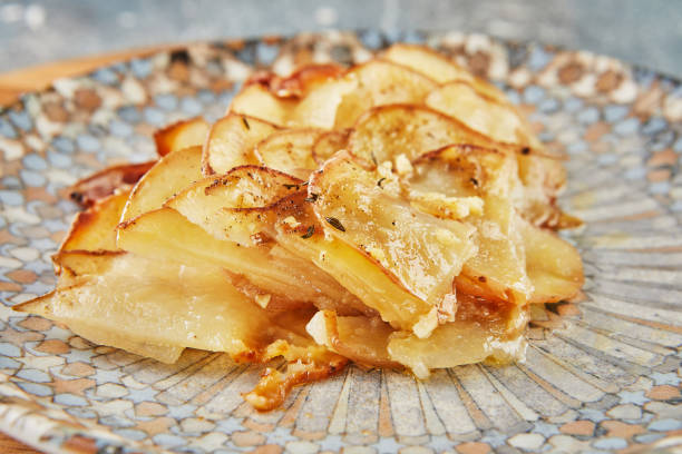 istock Potato pie with garlic and thyme on plate 1393934442