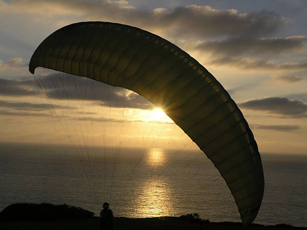 Hang glider in sunset stock photo