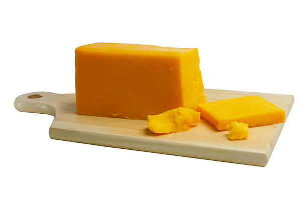 Cheese on Board with Clipping Path Block of Cheese on Cutting Board on White Background with Clipping Path. colby cheddar stock pictures, royalty-free photos & images