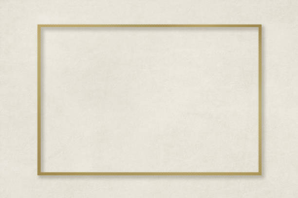A golden frame on an elegant beige background with a matte texture