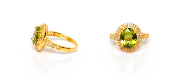 istock Peridot and Diamond Jewel or gems ring on white background with reflection. Collection of natural gemstones accessories. Studio shot 1393939447