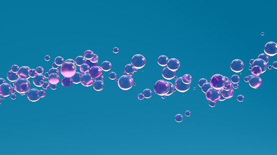Close-up of soap sud (bubbles foam) on a blue water.