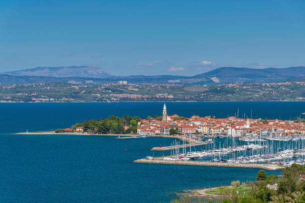 Springtime in Slovenia The aerial view on a small historic town, called Izola on the slovenian coast with majestic ulian Alps in the background koper slovenia stock pictures, royalty-free photos & images