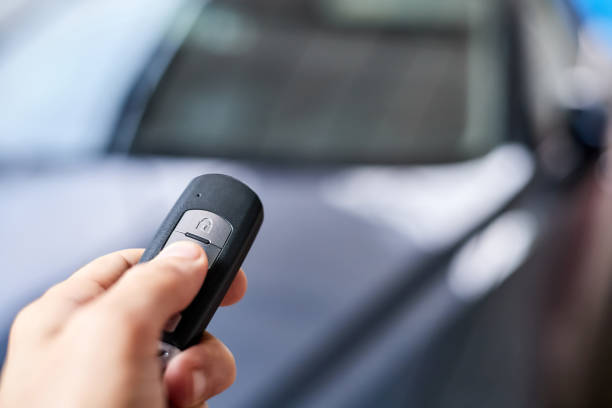 istock The car owner holds in his hand a remote control device for keyless entry. Close-up, selective focus 1393944410