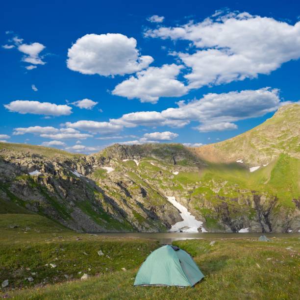 istock touristic camp in a mountain valley 1393945567