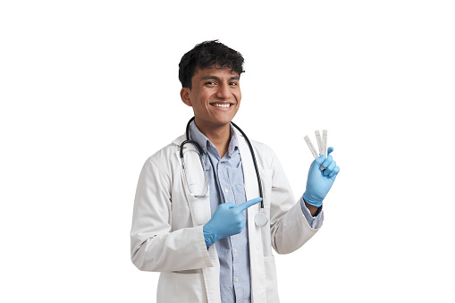 Young peruvian male doctor holding negative covid-19 antigen tests. Isolated over white background.