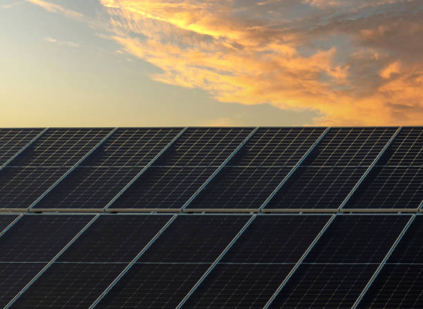 istock Solar panel on beautiful orange sundown background.. Alternative energy concept, copy space. 1393950576