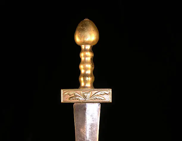 Brass hilt of a very old sword.