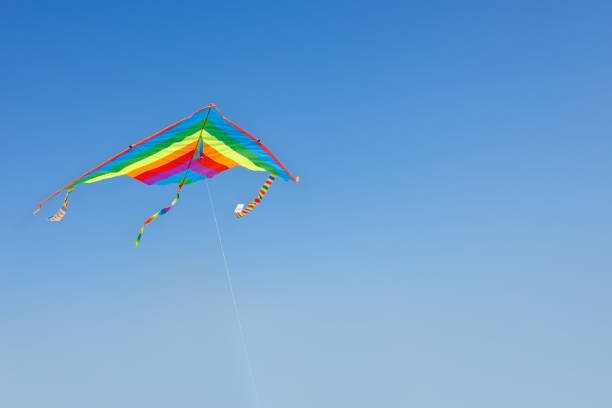 istock kite flying in the clear blue sky 1393951730