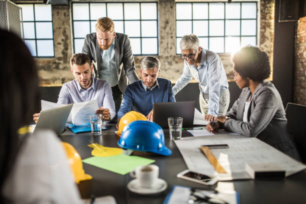 istock Team of architects working on business plan in the office. 1393956857