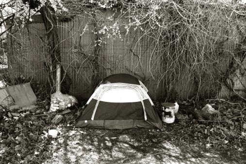 A photograph of a pitched tent on an Oklahoma City street alley.