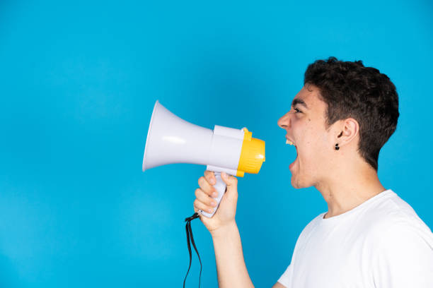 istock Hispanic teenager shouting at copy space 1393959178