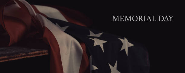 istock text memorial day and american flag, web banner 1393961385