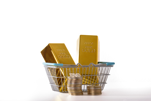 shopping basket with an abundance of cash, gold, bitcoins and assorted wealth