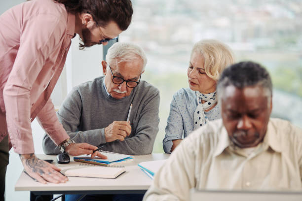 istock A multiracial group of senior students is talking with a young educator about the use of social media in the classroom. 1393964596