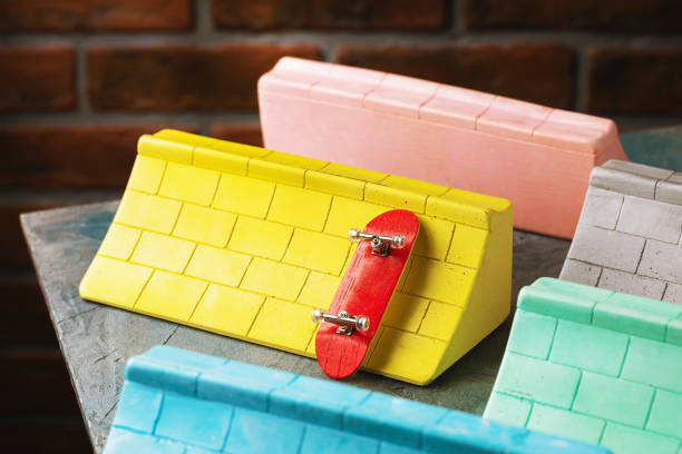 istock Multi-colored plaster ramps and fingerboard on the table, close-up 1393966615