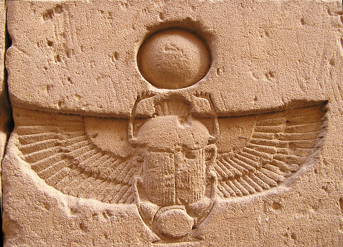 Stone pharaoh tutankhamen mask on papyrus background