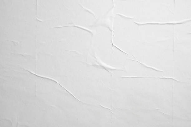 istock white crumpled and creased paper poster texture background 1393967824