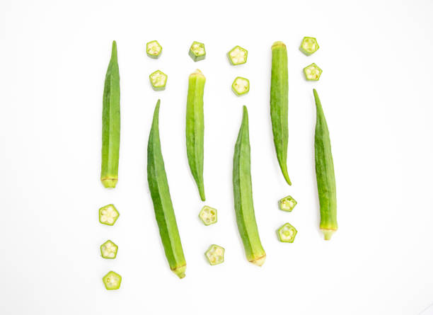 whole okra and slices Lady Finger design over on white background stock photo