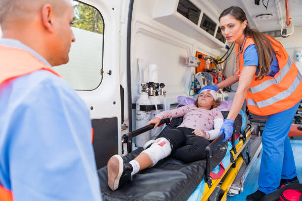 istock Doctor and paramedics helping child 1393968855