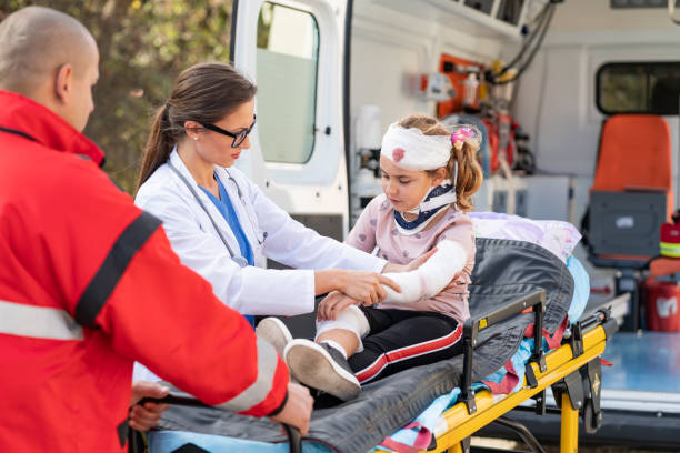 istock Doctor and paramedics helping child 1393968857