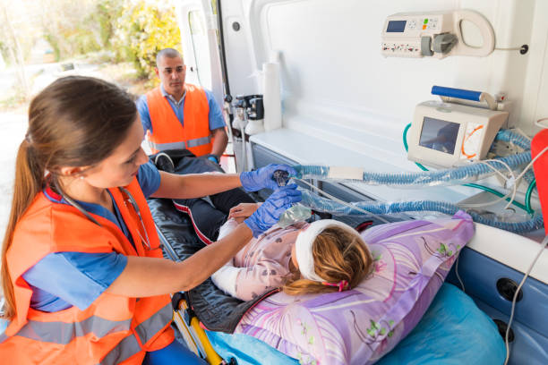 Doctor wheeling patient