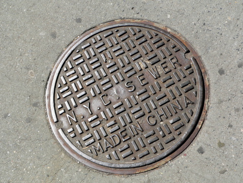 A clean manhole cover made in India for NYC.