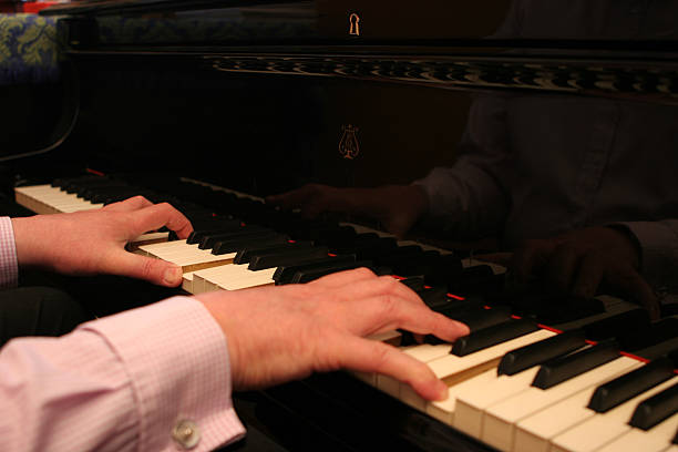 istock Pianist playing a concert grand piano 139397560