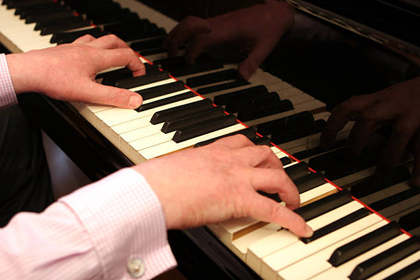 istock Pianist playing a concert grand piano 139397561