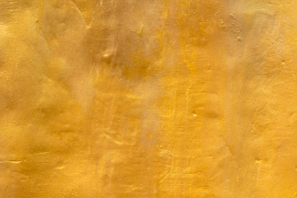 istock shiny golden color old wall texture background 1393976090
