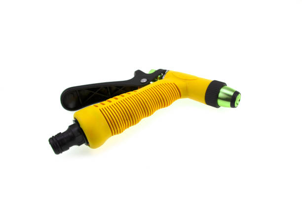 istock Hose nozzle spraying water isolated on white background. 1393977969