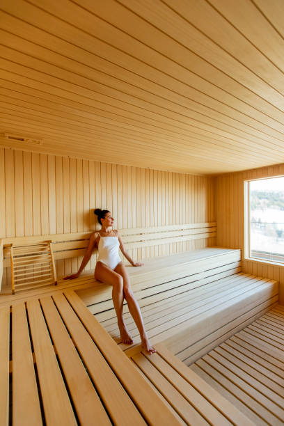 istock Young woman relaxing in the sauna 1393977974