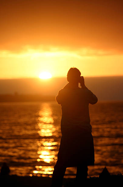 Uomo fotografie tramonto - foto stock