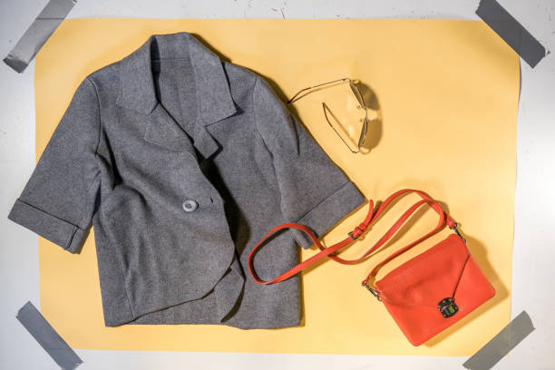 istock gray women's jacket and handbag on yellow background 1393981360