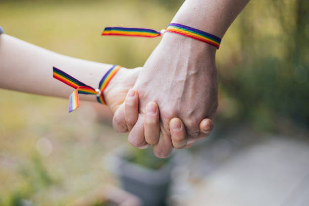 lgbtq+ - gay pride wristband rainbow lgbt foto e immagini stock