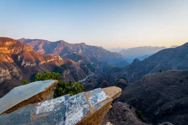 istock Aerial view of misty mountains at sunset 1393982649