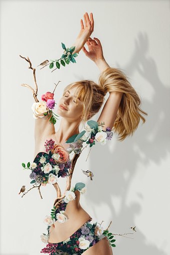 Contemporary art collage. Creative portrait of beautiful woman with spring flowers instead body. Concept of beauty, summer, vacation, mood, grace, tenderness, ads. Modern design for poster, picture