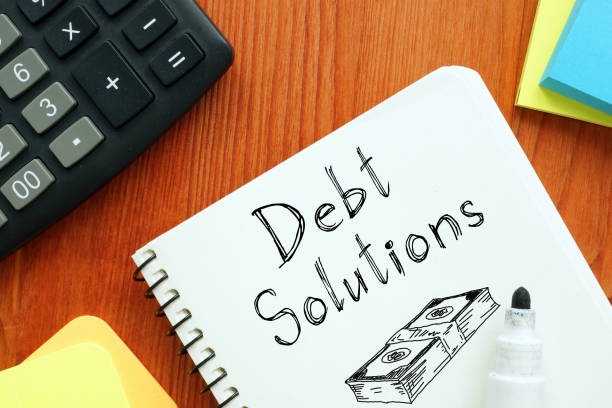 istock Debt solutions are shown using the text and picture of dollars 1393983474