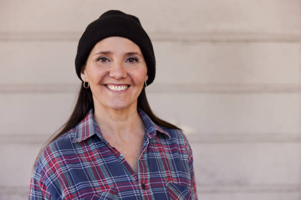 istock A middle-aged hipster woman is posing for the camera. 1393986741