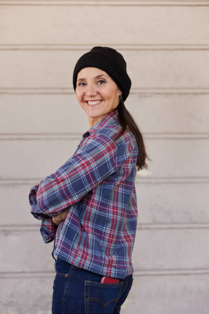 istock A middle-aged hipster woman is posing for the camera. 1393986749