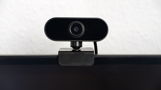 Close-up of webcam clamped on monitor with copyspace