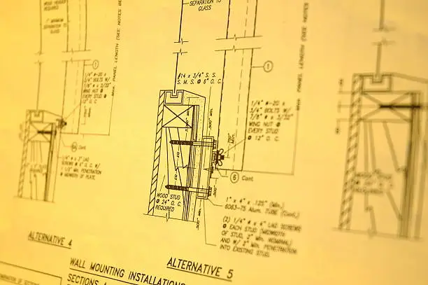 a set of blueprints shot with a nikon d70 using yellow gels.