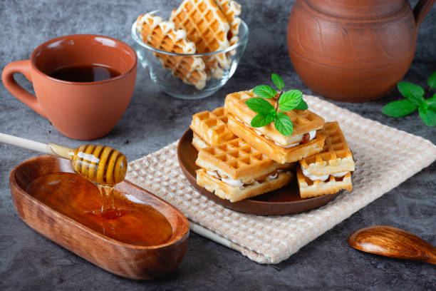 istock Breakfast with Belgian waffles, honey and coffee 1393989681