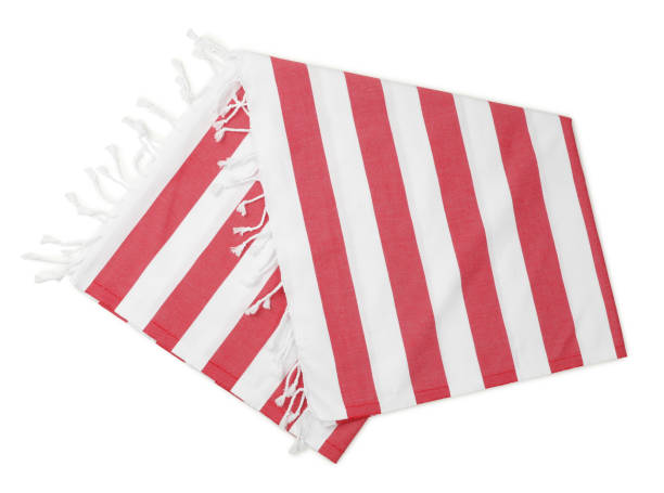 istock Striped beach towel isolated on white, top view 1393990542