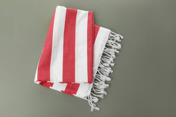 istock Folded striped beach towel on grey background, top view 1393990653
