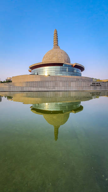 istock buddha stupa with water reflection and bright blue sky at morning 1393990668