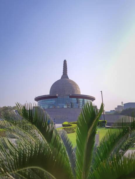 istock buddha stupa through leafs with bright sky at morning from low angle 1393990891