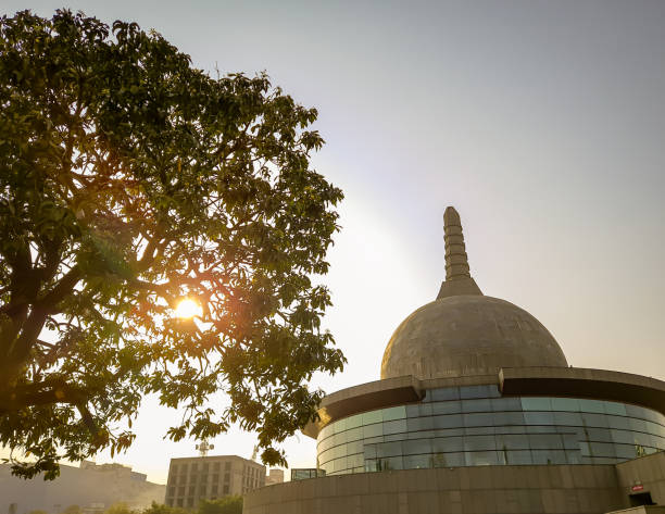 istock buddha stupa through leafs with bright sky at morning from low angle 1393990985