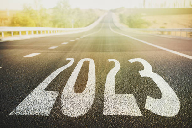 istock Start new year with fresh vision and ideas. 2023 numbers on asphalt road 1393991099