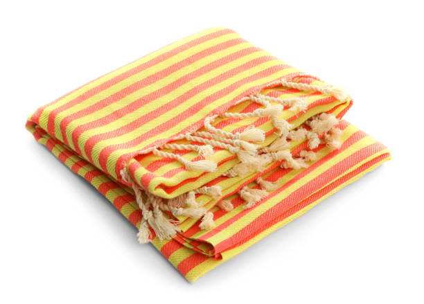 istock Folded striped beach towel isolated on white 1393991117